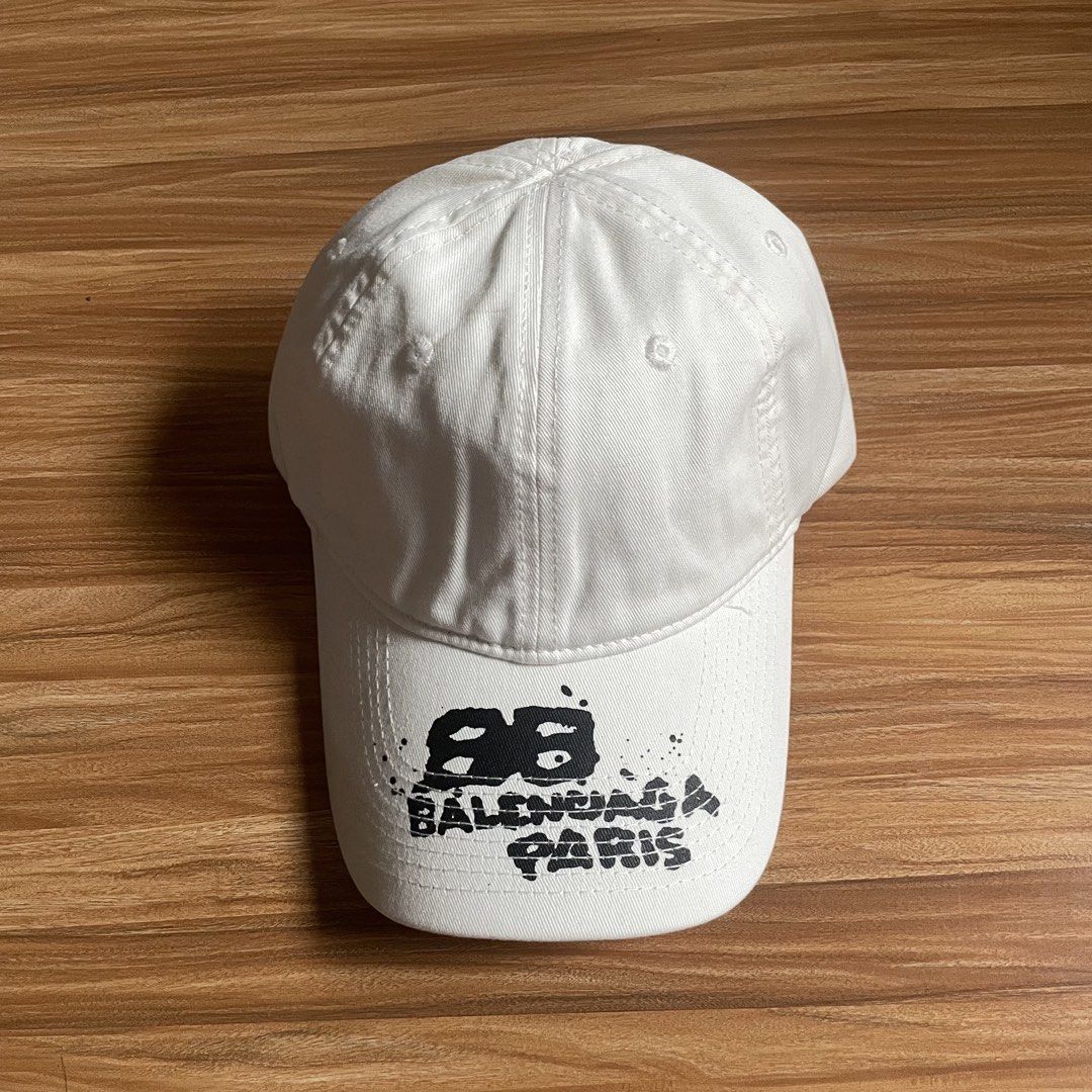 Balenciaga Hand Drawn BB Icon Velcro Tab Baseball Cap (Category: Caps & Hats) located in General Mariano Alvarez. Submitted by 4117_thriftnthrive (Listing ID 1457418037, Image 1). Description: In excellent condition No flaws Size: OSFA ₱850 Plus Shipping Fee.