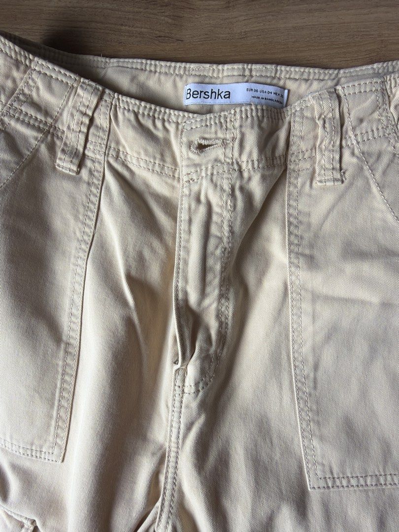 Bershka Beige Cargo Pants (Category: Other Bottoms) located in Pasig City. Submitted by mrssalapi (Listing ID 1457356598, Image 3). Description: - Beige cargo pants from Bershka - Multiple pockets for convenience - Adjustable ties at the ankles for a customized fit - Perfect for comfortable everyday wear.
