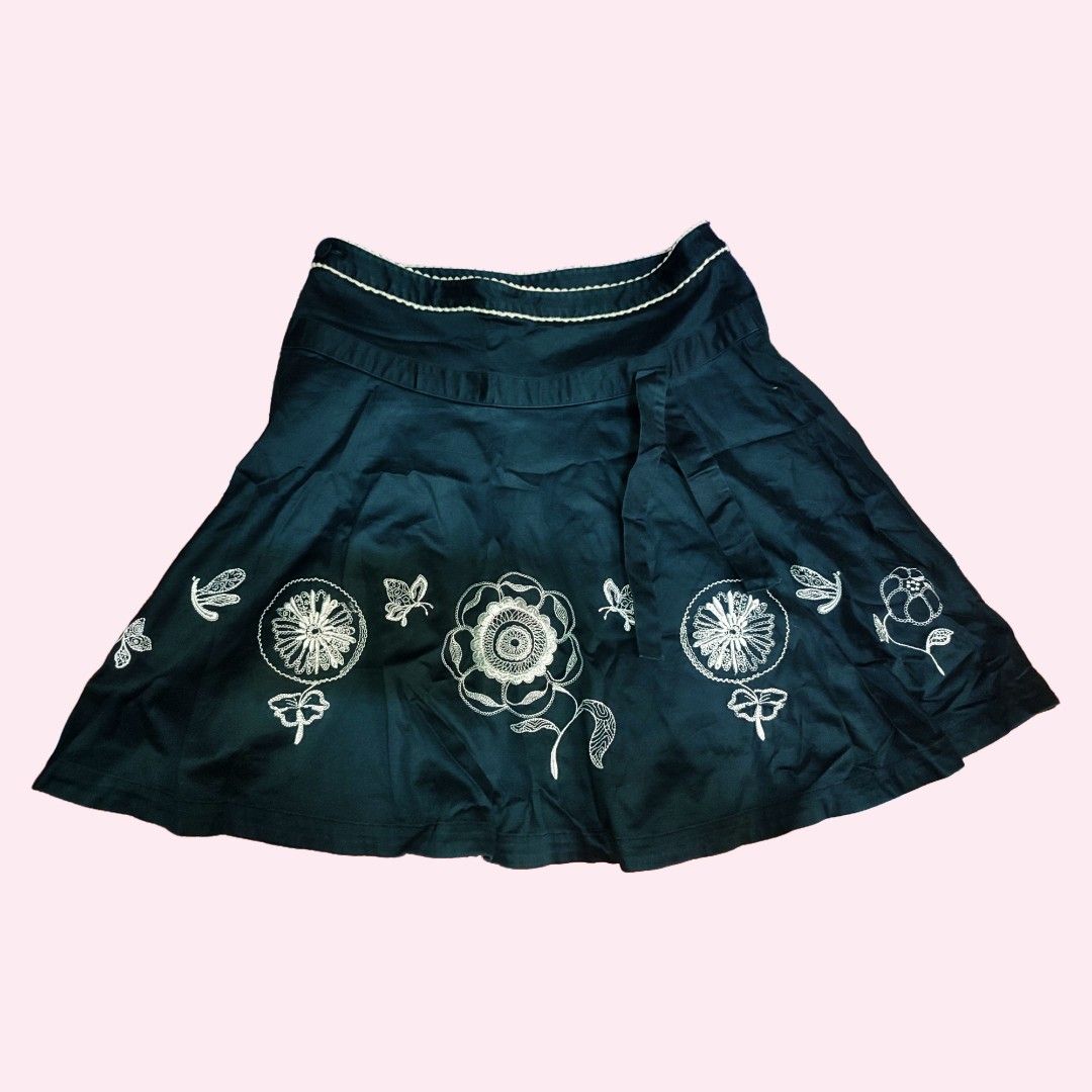 Black A-line Skirt with White Floral Embroidery (Category: Skirts) located in Caloocan City. Submitted by faesrie (Listing ID 1457504390, Image 1). Description: - 27-28 inches waist - 19 inches length - Cute black A-line skirt - Features white floral and butterfly embroidery - Hits above the knee - Side tie detail for adjustable fit - Versatile for casual or dressed-up looks - Easy to pair with various tops.