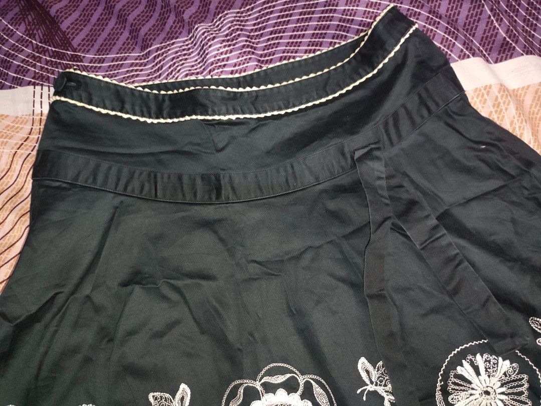 Black A-line Skirt with White Floral Embroidery (Category: Skirts) located in Caloocan City. Submitted by faesrie (Listing ID 1457504390, Image 3). Description: - 27-28 inches waist - 19 inches length - Cute black A-line skirt - Features white floral and butterfly embroidery - Hits above the knee - Side tie detail for adjustable fit - Versatile for casual or dressed-up looks - Easy to pair with various tops.
