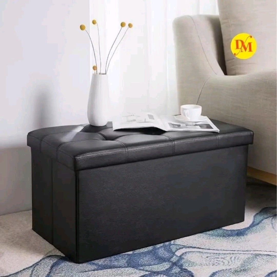 Black Tufted Storage Ottoman Bench Footrest (Category: Chairs) located in Manila. Submitted by marvieobordo (Listing ID 1457495791, Image 2). Description: - Black storage ottoman with tufted top and white stitching. - Provides extra seating, storage, or can be used as a footrest/bench. - Folds flat for convenient storage when not in use. - Sturdy construction for durability..
