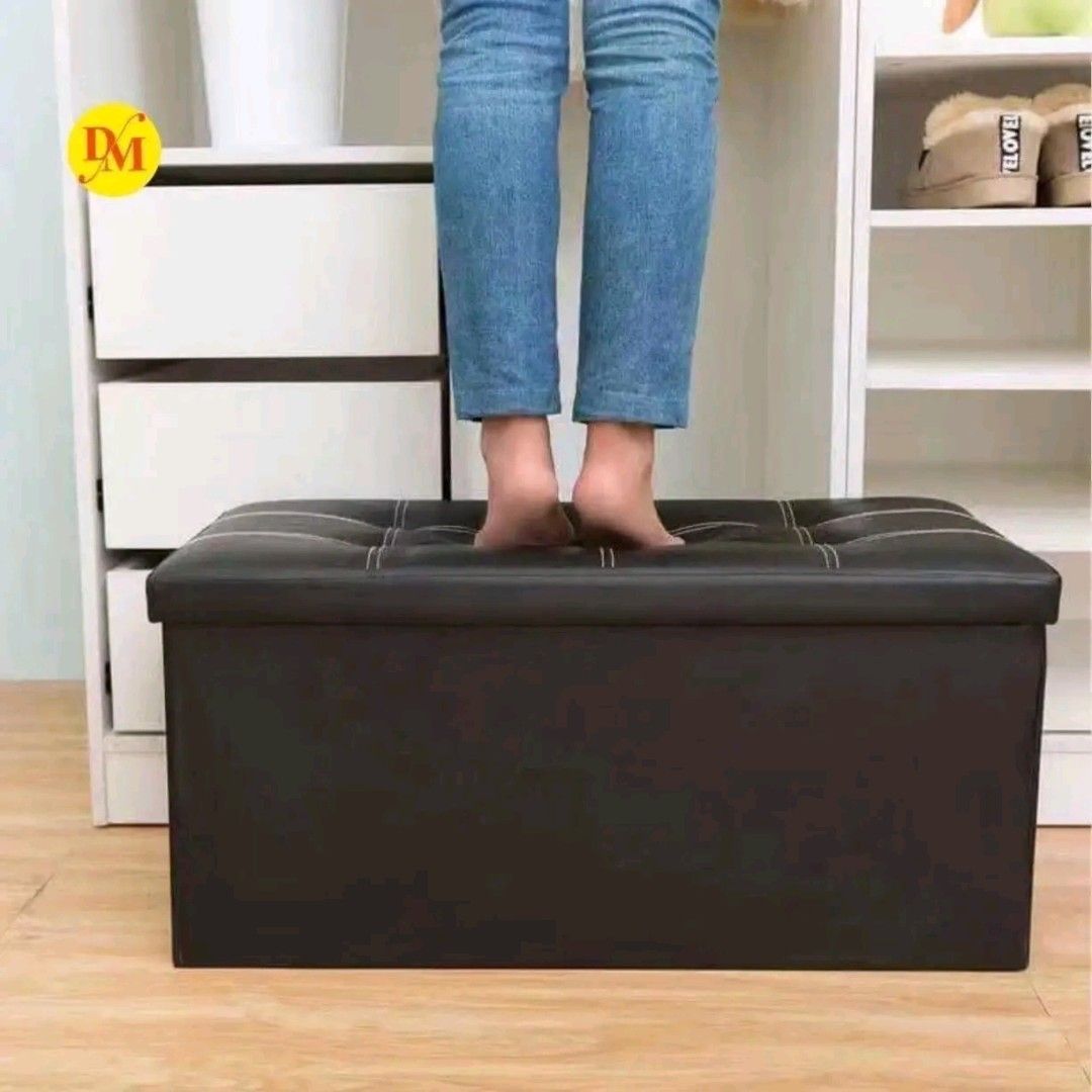 Black Tufted Storage Ottoman Bench Footrest (Category: Chairs) located in Manila. Submitted by marvieobordo (Listing ID 1457495791, Image 3). Description: - Black storage ottoman with tufted top and white stitching. - Provides extra seating, storage, or can be used as a footrest/bench. - Folds flat for convenient storage when not in use. - Sturdy construction for durability..