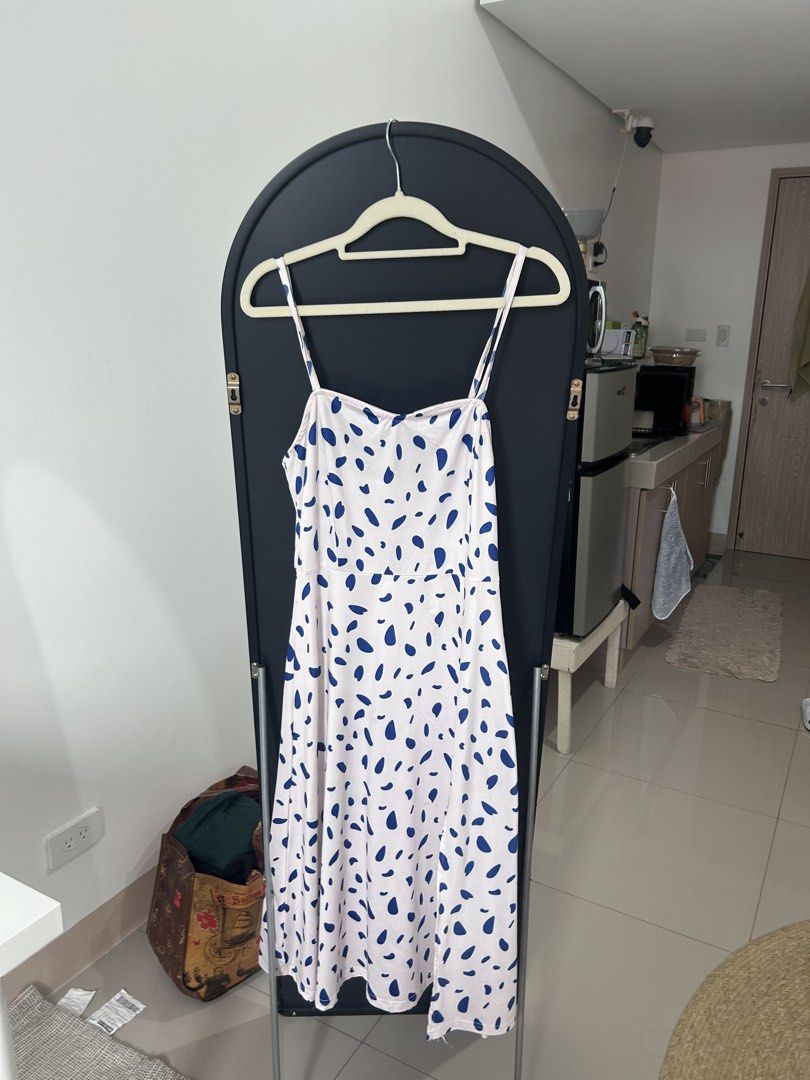 blue pebble dot white long dress with slit (Category: Dresses) located in Manila. Submitted by chloemapa (Listing ID 1457380206, Image 1). Description: blue pebble dot white long dress with slit super good qual/super soft flaw: tag was removed so i cant tell the brand fits XS-M; see pics for when worn adjustable rfs: decluttering.