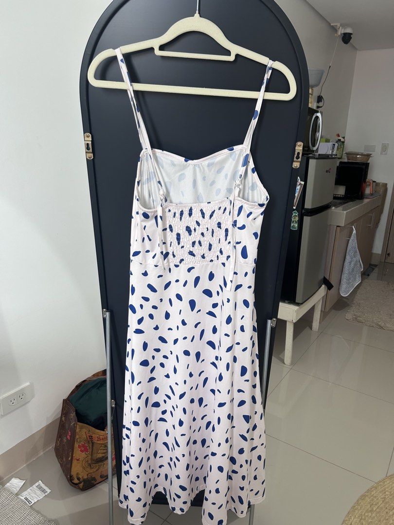 blue pebble dot white long dress with slit (Category: Dresses) located in Manila. Submitted by chloemapa (Listing ID 1457380206, Image 2). Description: blue pebble dot white long dress with slit super good qual/super soft flaw: tag was removed so i cant tell the brand fits XS-M; see pics for when worn adjustable rfs: decluttering.