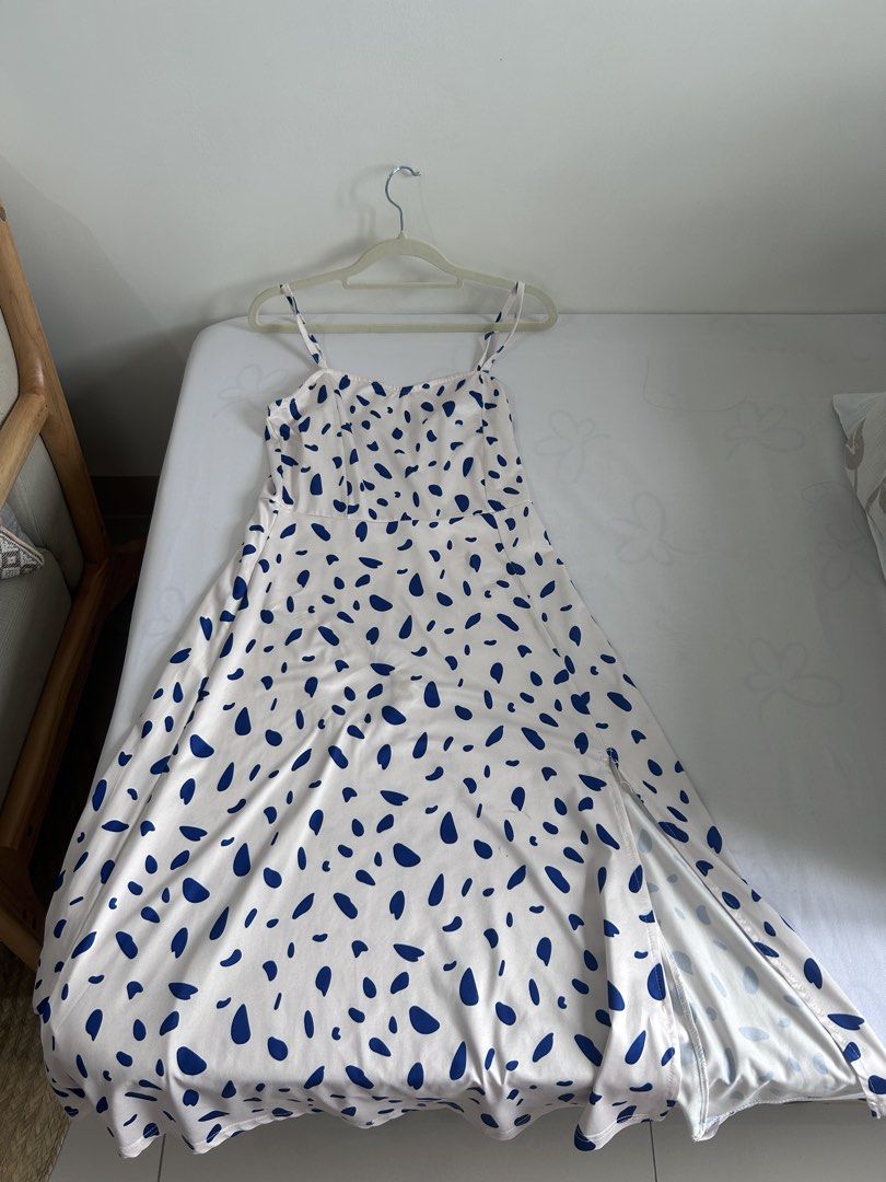 blue pebble dot white long dress with slit (Category: Dresses) located in Manila. Submitted by chloemapa (Listing ID 1457380206, Image 3). Description: blue pebble dot white long dress with slit super good qual/super soft flaw: tag was removed so i cant tell the brand fits XS-M; see pics for when worn adjustable rfs: decluttering.