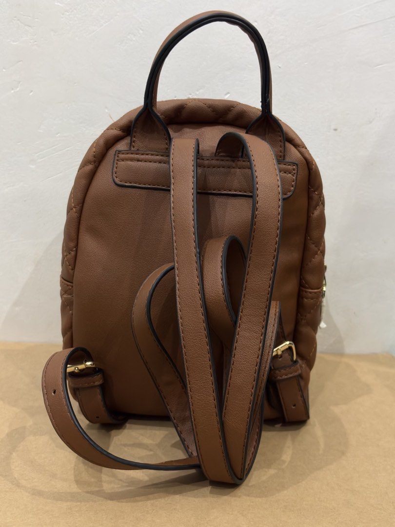 Brown faux leather mini backpack (Category: Backpacks) located in Pasig City. Submitted by collinemaeee (Listing ID 1457435011, Image 2). Description: Brown faux leather mini backpack Unused Cainta loc Price negotiable RFS decluttering.