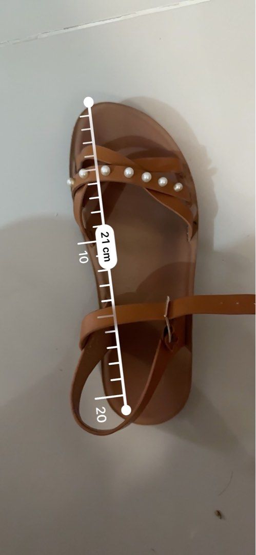 Brown Flat Sandals with Pearl Embellishments (Category: Flats & Sandals) located in Manila. Submitted by meynyee (Listing ID 1457351886, Image 2). Description: - Cute brown flat sandals - Strappy design with pearl embellishments - Adjustable buckle closure - Sole length: approximately 21cm - Ideal for casual wear 📍Dasma, Cavite.