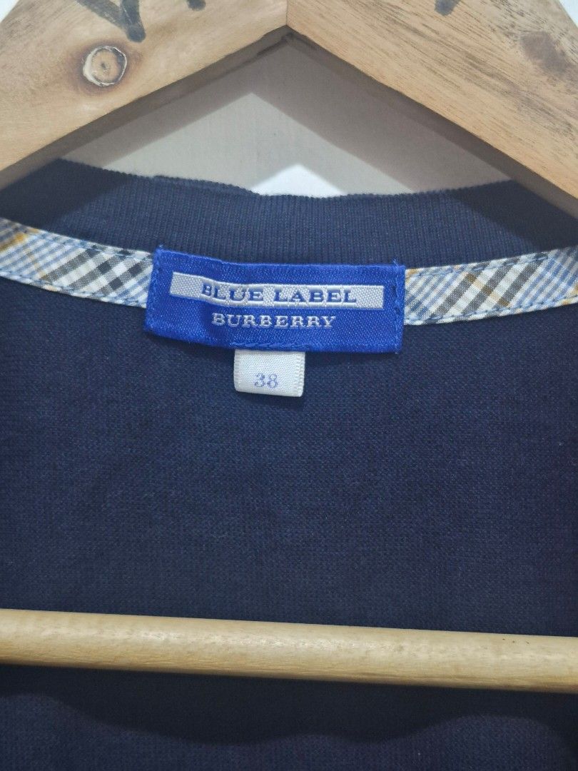 Burberry Blue Label Navy Cardigan (Category: Coats, Jackets and Outerwear) located in Bulacan. Submitted by vince4593 (Listing ID 1457414099, Image 3). Description: - Burberry Blue Label navy cardigan - Size 38 - Iconic Burberry check lining on collar - Small embroidered logo on chest - Button-up front - Ideal for layering.