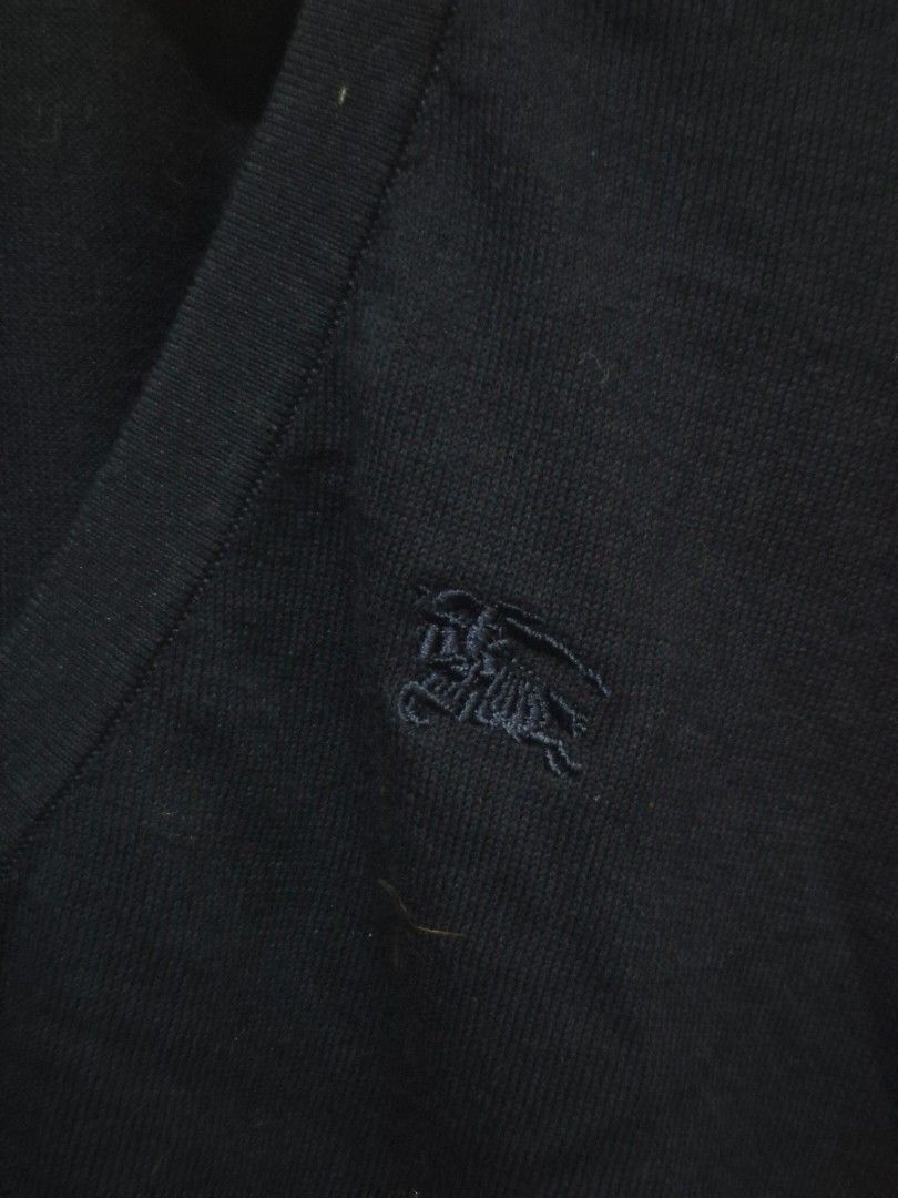 Burberry Blue Label Navy Cardigan (Category: Coats, Jackets and Outerwear) located in Bulacan. Submitted by vince4593 (Listing ID 1457414099, Image 2). Description: - Burberry Blue Label navy cardigan - Size 38 - Iconic Burberry check lining on collar - Small embroidered logo on chest - Button-up front - Ideal for layering.