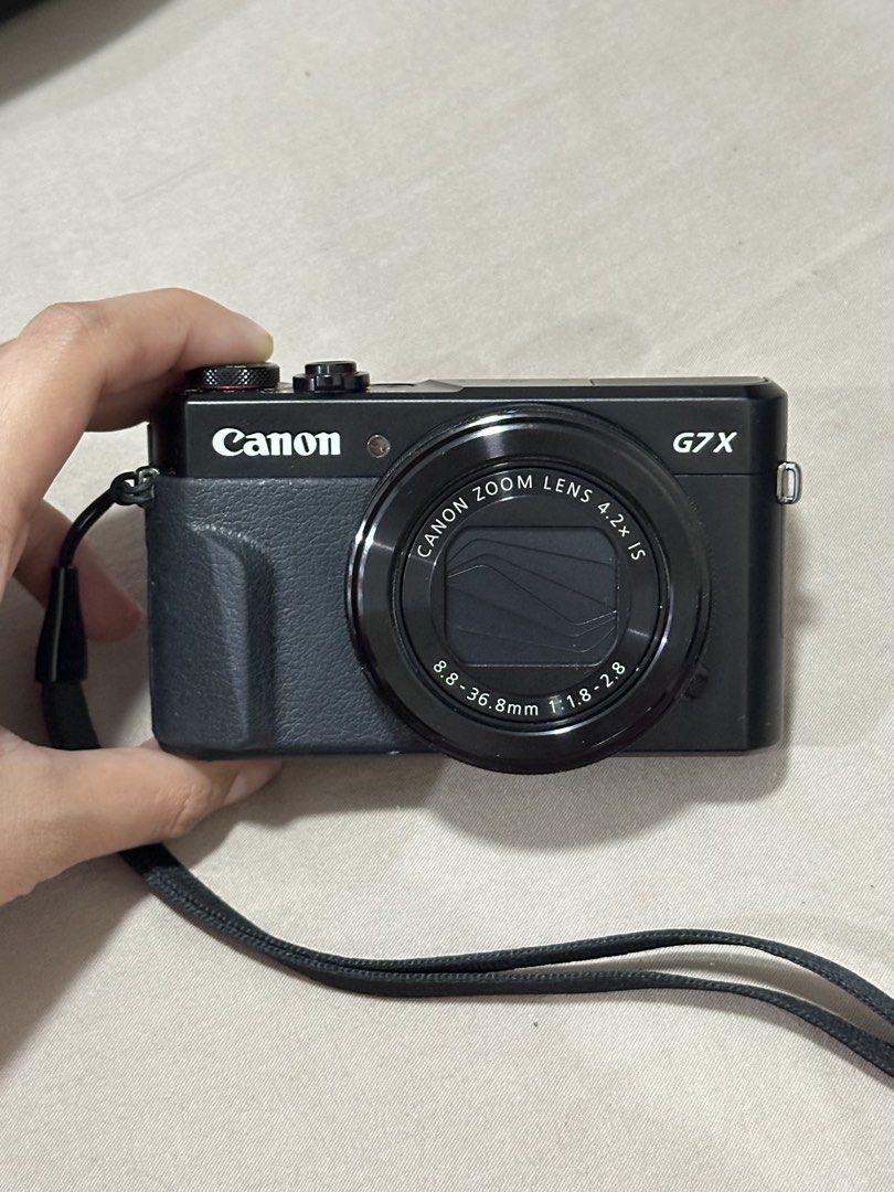 Canon PowerShot G7X Mark II Digital Camera (Category: Cameras) located in Cabanatuan. Submitted by calliethrifts (Listing ID 1457491905, Image 2). Description: 📸 FOR SALE: Canon PowerShot G7X Mark II Digital Camera 💰 ONLY ₱46,999 ✨ Condition: • Fully Functional • Body Cosmetics: 8/10 • Signs of Usage / Normal Wear • No Functional Issues • Ready to Use 📦 Inclusions: • Canon PowerShot G7 X Mark II Camera Unit • 3× Batteries • Original Canon Char