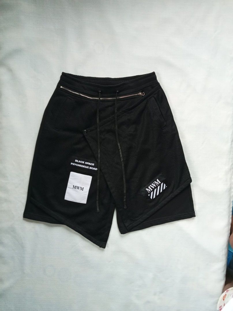 CDG MWM black psychedelic asymmetrical sweat short (Category: Shorts) located in Bagabag. Submitted by thrift_stories96 (Listing ID 1457487150, Image 1). Description: CDG MWM black psychedelic asymmetrical sweat short Medium to Large frame Waistline - 32 to 34 Length - 23 Leg opening - 12 Condition - 8/10 Color rate - 9.5/10 Flaw - lints need reshave.