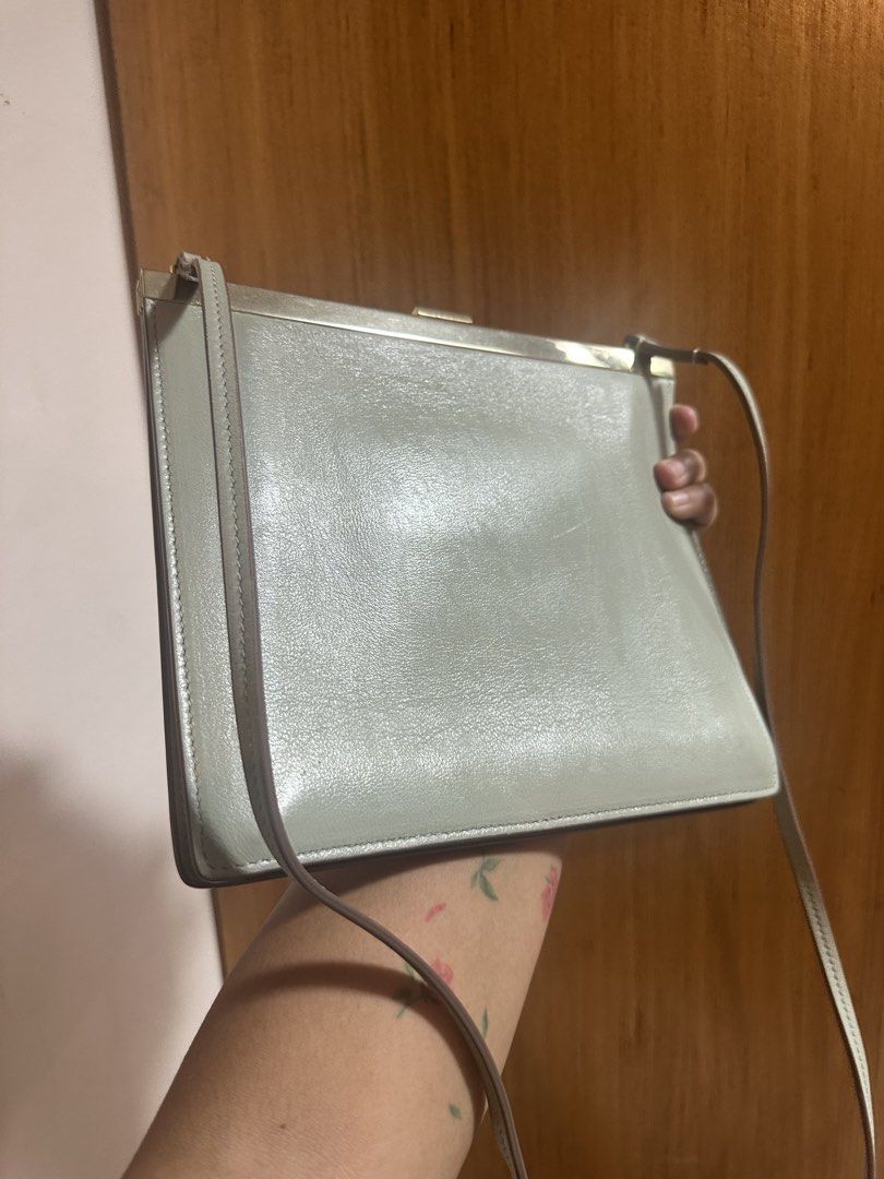 Celine Paris Leather Shoulder Bag (Category: Luxury Bags & Wallets) located in Pasig City. Submitted by zelinavillaflor (Listing ID 1457460019, Image 3). Description: - Light grey Celine shoulder bag - Genuine leather material - Elegant gold hardware - Adjustable long strap for comfortable wear - Chic clasp closure detail - Pristine and clean interior - Versatile for everyday or special events - A timeless Celine classic.