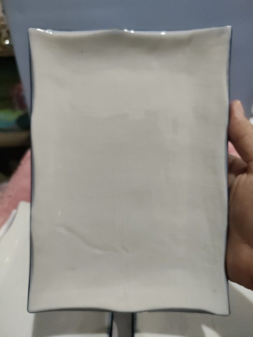 Ceramic rectangular serving plates (Category: Dinnerware & Cutlery) located in Bulacan. Submitted by hunterherojapanjdm (Listing ID 1457498749, Image 3). Description: Set of white ceramic rectangular serving plates with distinct uneven blue rims..