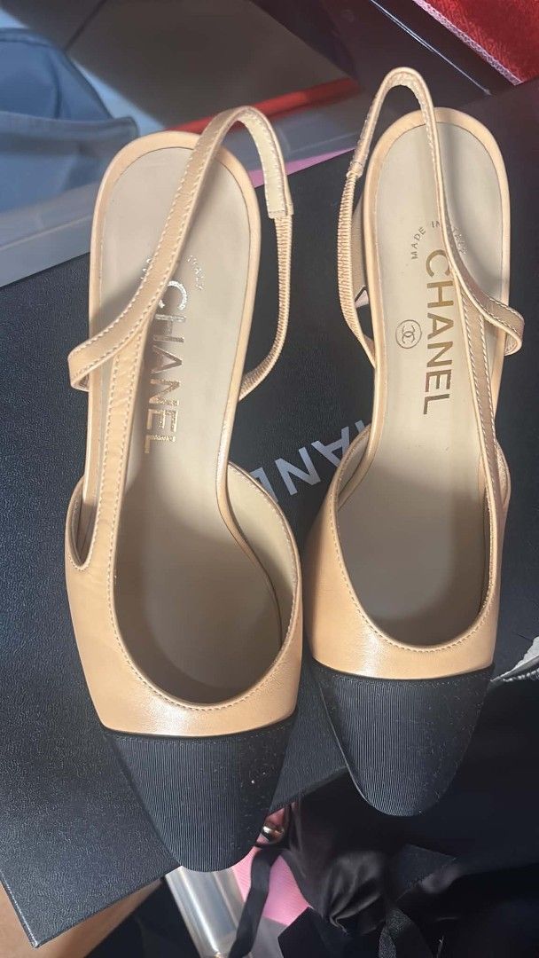 Chanel Slingback Heels Beige Black Cap Toe Slingbacks (Category: Sneakers & Footwear) located in Quezon City. Submitted by melmgpy (Listing ID 1457463553, Image 3). Description: - Classic Chanel slingbacks - Beige leather with black cap toe - Secure slingback strap - Comfortable block heel - Iconic CC logo detail on heel - Versatile for dressing up or down - Timeless and iconic design.