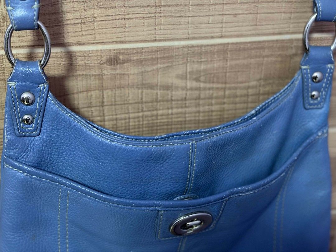 Coach Blue Leather Crossbody Bag (Category: Cross-body Bags) located in Bulacan. Submitted by gratsy (Listing ID 1457386433, Image 3). Description: - Authentic Coach blue leather crossbody bag - Front pocket with secure turn-lock closure - Adjustable strap for comfortable wear - Elegant silver hardware details - Spacious interior for your everyday essentials - A timeless Coach classic, perfect for daily use.