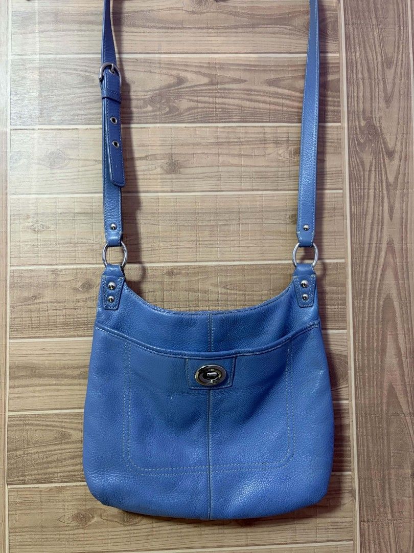 Coach Blue Leather Crossbody Bag (Category: Cross-body Bags) located in Bulacan. Submitted by gratsy (Listing ID 1457386433, Image 2). Description: - Authentic Coach blue leather crossbody bag - Front pocket with secure turn-lock closure - Adjustable strap for comfortable wear - Elegant silver hardware details - Spacious interior for your everyday essentials - A timeless Coach classic, perfect for daily use.