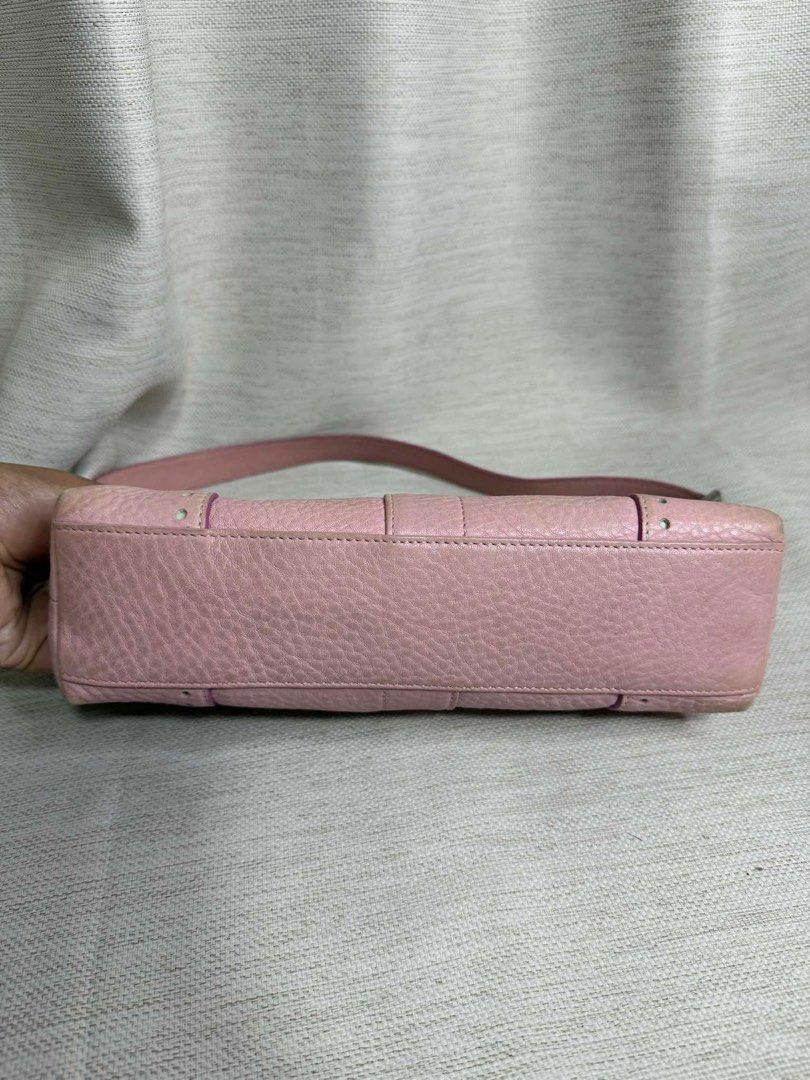 Coach Pink Leather Shoulder Bag (Category: Luxury Bags & Wallets) located in Manila. Submitted by sakurumifinds2809 (Listing ID 1457376425, Image 3). Description: - Cute pink Coach shoulder bag - Genuine leather with textured finish - Silver hardware - Zip closure - Small stud details on bottom corners - Adjustable strap - Ideal for everyday use.