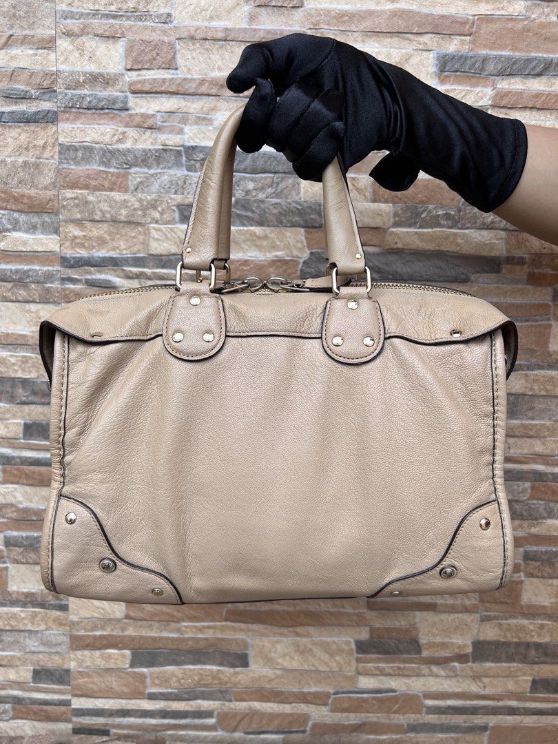 Coach Rhyder 32 Satchel (33689) (Category: Luxury Bags & Wallets) located in Cavite. Submitted by justbrowsing_decluttering (Listing ID 1457400694, Image 3). Description: Top Handle Bag 1 Full zip pocket inside | 3 small open pocket inside Color: Beige with Gold Tone Hardware Size: Large Material: Genuine Leather [Colors may vary due to lighting. Bags are Preowned so it will Not be Perfect; Unless stated new.] No Sling Strap Signs of use on hardw