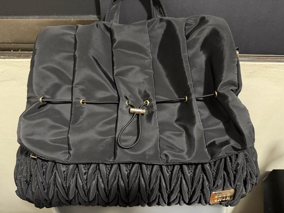Cocolala Kyler Diaper Bag (Category: Diaper Bags & Wetbags) located in Manila. Submitted by mamamiaaaaa27 (Listing ID 1457465499, Image 1). Description: Bought it at the Baby Company baby fair. - Color: Black - Dimensions: 17”L x 5”W x 12”H - Material: Water resistant nylon fabric - Backpack type - Comes with a cross body strap and detachable stroller straps - Changing pad unused and kept in storage Only issue: the magnet closure at the back pock