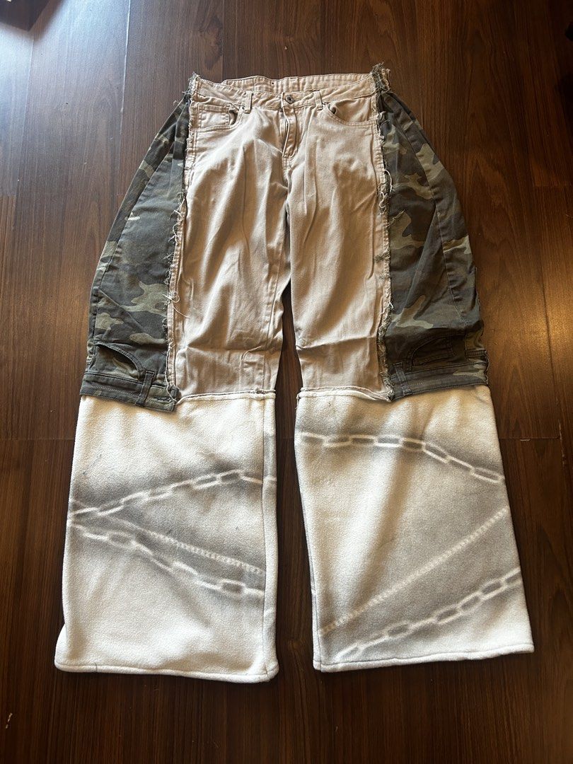 Customized Camo & Fleece Patchwork Pants (Category: Jeans) located in Manila. Submitted by bbstyle___ (Listing ID 1457375052, Image 1). Description: -Waist 32 - Unique customized tan denim pants - Camo patchwork detailing on the sides - Extended white fleece bottoms with printed chain design - Raw edges and distressed details throughout - Perfect statement piece for your wardrobe.