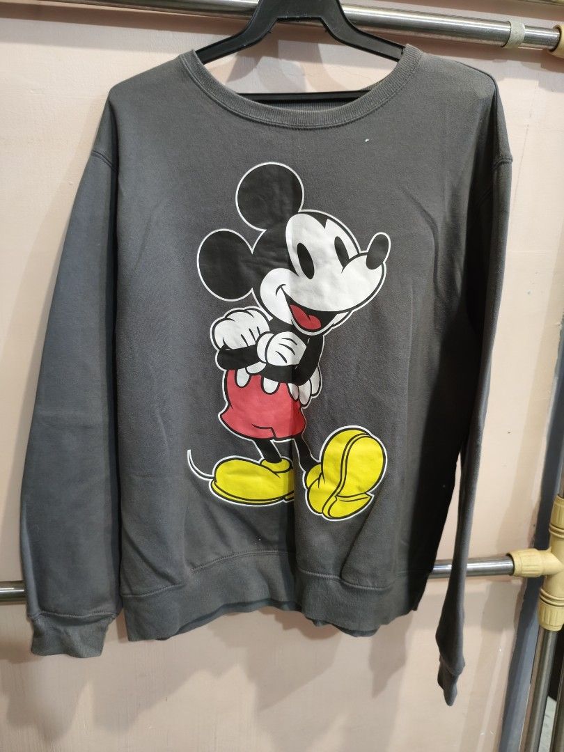 Disney Mickey Mouse Grey Crewneck Sweatshirt (Category: Coats, Jackets and Outerwear) located in Marikina City. Submitted by noemitee (Listing ID 1457417707, Image 1). Description: - Grey crewneck sweatshirt - Classic Mickey Mouse graphic (red shorts, yellow shoes) - Long sleeves - Comfortable fit - Ideal for casual wear - A must-have for Disney fans.