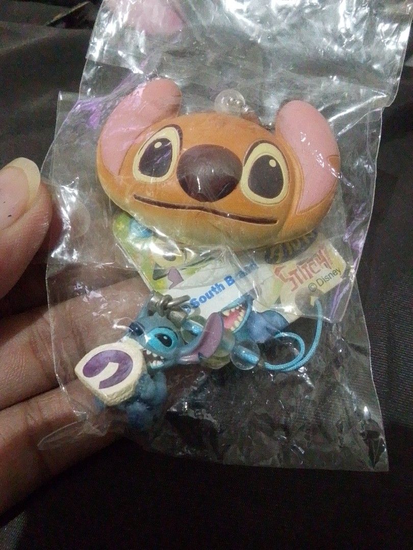 Disney Stitch Keychain Set (Category: Character Goods) located in Santa Rosa. Submitted by loisy32336 (Listing ID 1457469594, Image 1). Description: Cute Stitch keychain set (large head & small figure with pastry). Still in original packaging. Perfect for Lilo & Stitch fans!.