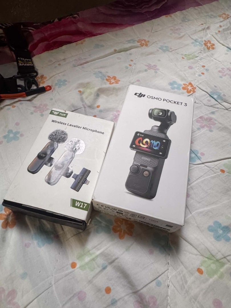 DJI Osmo Pocket 3 with TNW Wireless Lavalier Microphone (Category: Microphones) located in Caloocan City. Submitted by eyeshieldtwentyone20-13490 (Listing ID 1457381582, Image 1). Description: - DJI Osmo Pocket 3 camera (out of box, as pictured) - TNW W17 wireless lavalier microphone set (brand new, sealed) - Original boxes included for both items - Ideal for vlogging and content creation.