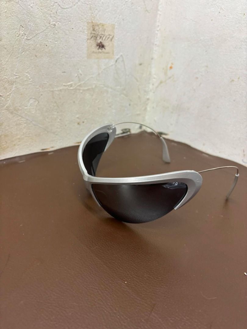 Fast Lane Y2K Wrap-Around Shield Sunglasses | Silver (Category: Sunglasses & Eyewear) located in Bacoor. Submitted by fafofa (Listing ID 1457499175, Image 2). Description: Fast Lane futuristic silver Y2K wrap-around shield sunglasses featuring an aerodynamic curved frame and dark tinted lenses. • Silver finish • Wrap-around shield design • Dark tinted lenses • Futuristic Y2K aesthetic • Frame Length: 9.75" • Frame Height: 2.5" • Arm Length: 4".