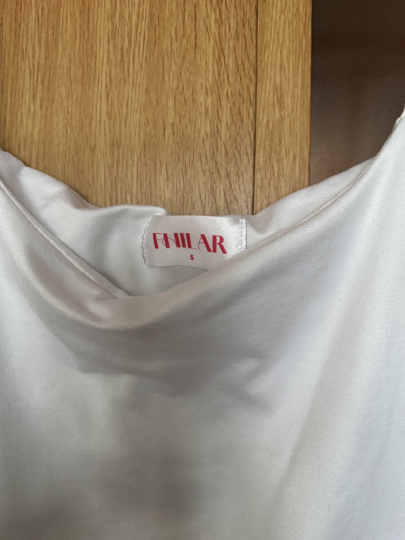 FHILAR Allison Tank Top White (Category: Sleeveless) located in Manila. Submitted by farfromregularco (Listing ID 1457389588, Image 3). Description: Never worn, only washed! RFS: Not my style. Selling low! Get this white top and the black one for only ₱100! Delivery Details: 📍MOA Pasay, Manila Payment: BPI / Gcash / COD Message me for meetups Shipping: Grab / Lalamove / MrSpeedy Message me for meetups. (LRT, MRT, Major Landmarks) Shipping must b