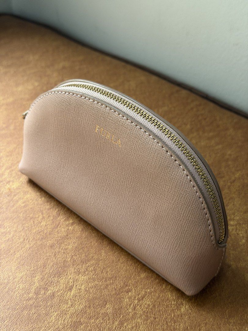 Furla Dome Pouch in Blush Pink (Category: Purses & Pouches) located in Pasay City. Submitted by elleventh (Listing ID 1457411473, Image 2). Description: Furla Blush Pink Dome Pouch — Rank A (9/10) — 6” x 3.8” x 1.3” Selling for only ₱1950 All items are guaranteed authentic and are personally curated and sourced by the founder. If you wish to get a certificate of authenticity from a trusted third party company, you may message us for more details.