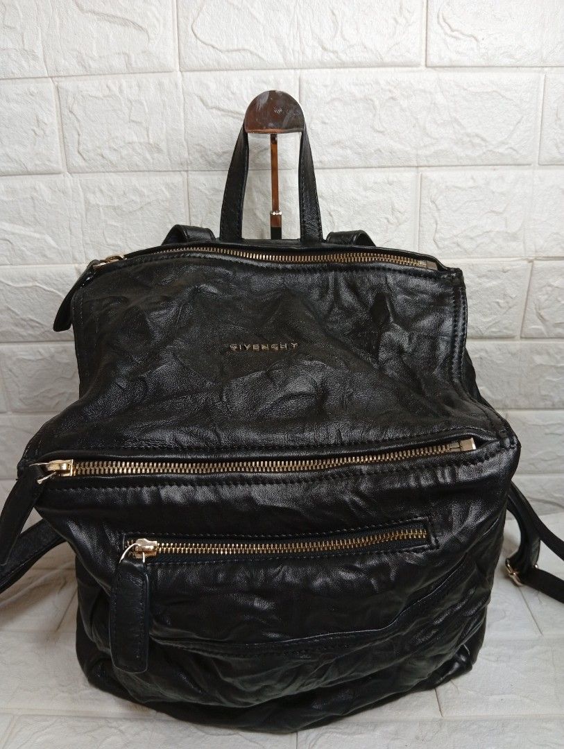 Givenchy Black Leather Wrinkled Backpack (Category: Luxury Bags & Wallets) located in Las Pinas. Submitted by etoksi1234 (Listing ID 1457423147, Image 1). Description: Pre-loved Givenchy Pandora Backpack black crinkled leather bag. featuring gold-tone hardware, dual top zip closures, and the distinct slouchy structural design.