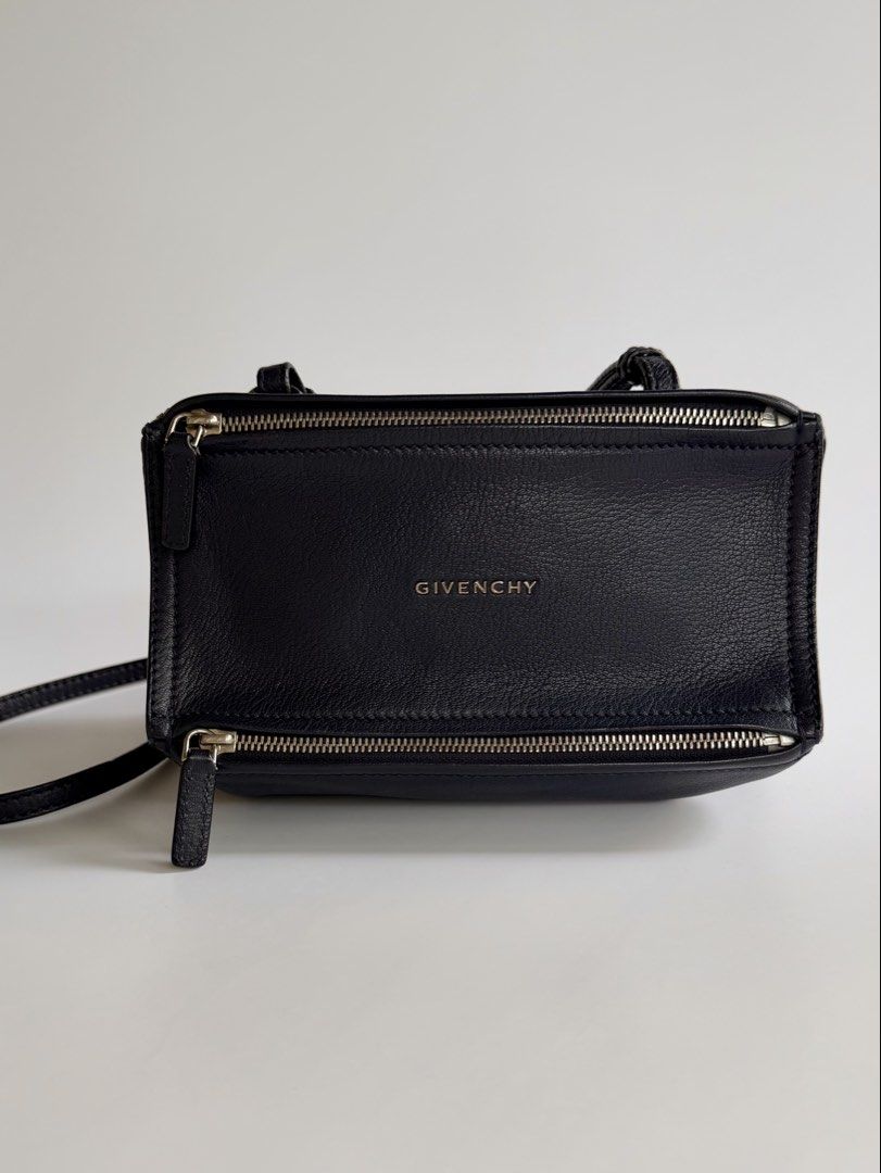 Givenchy Pandora Mini in Deep Navy Blue (Category: Luxury Bags & Wallets) located in Quezon City. Submitted by lian_closet (Listing ID 1457343417, Image 1). Description: Givenchy Pandora Mini in Deep Navy Blue Best Price: ₱28,000 Preloved Comes with Generic Dust Bag & LegitGrails Authenticity Certificate Preloved Rating: 8.9/10 Excellent Light cracks on strap Minimal scratches on hardware Interior is clean.