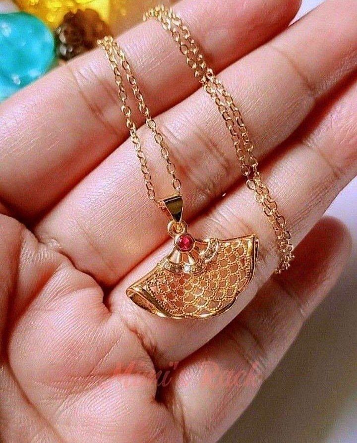 Golden Fan Necklace | Ruby Accent Gold Chain Necklace (Category: Necklaces) located in Taguig. Submitted by mimisrack (Listing ID 1457510849, Image 2). Description: 💛Elegant design with a touch of luxury. -Golden fan-shaped pendant with small ruby accent -Fan symbolizes good luck, grace, and prosperity -A refined necklace that adds subtle elegance and charm 🧿 chain length: approx. 46cm (18in), marked 18KGP 🧿 pendant size: 24mm ▪️keep jewelries