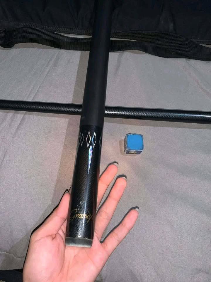Gramax Billiard Cue Stick with Case and Chalk (Category: Billiards and Bowling) located in Lopez. Submitted by kergg (Listing ID 1457434561, Image 2). Description: FS: Gramax Cue Stick ₱1,500 13mm tip screw tip ferrule inclusion: bag tisa - Granmax billiard cue stick - Sleek black design with silver accents - Comes with a protective carrying case - Includes one piece of blue chalk - Ideal for playing pool and ready for your next game.