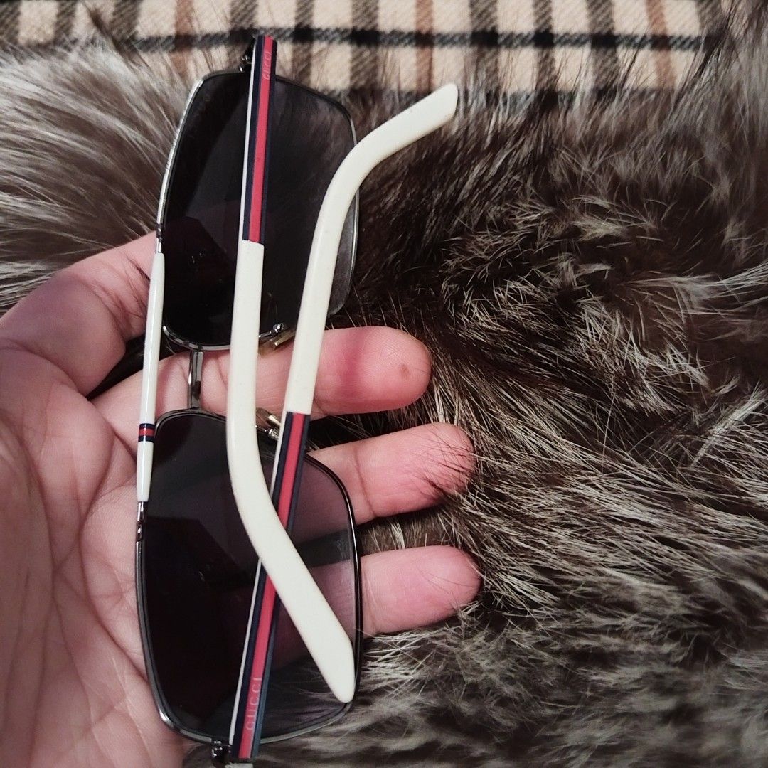 Gucci Men Sunglass (Category: Luxury Accessories) located in Bulacan. Submitted by brandedbagspreloved (Listing ID 1457389756, Image 3). Description: Authentic bought in japan my issue s lense my maliit na basag pero di nmn nag crack mababaw lang s bandang baba ng lense left side di makita s pixture no other issue last price posted.