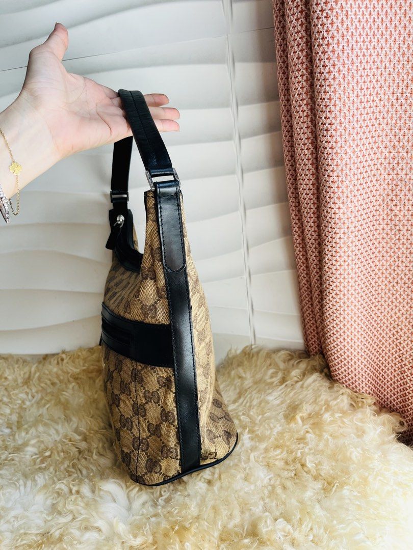 Gucci Monogram Canvas Hobo Bag (Category: Luxury Bags & Wallets) located in Davao. Submitted by goodthingsph_ (Listing ID 1457342983, Image 2). Description: - Classic GG Monogram Canvas - Black Leather Trim - Top Zipper Closure - Front Zipper Pocket - Interior Gucci Leather Tag - Great for Everyday Use.