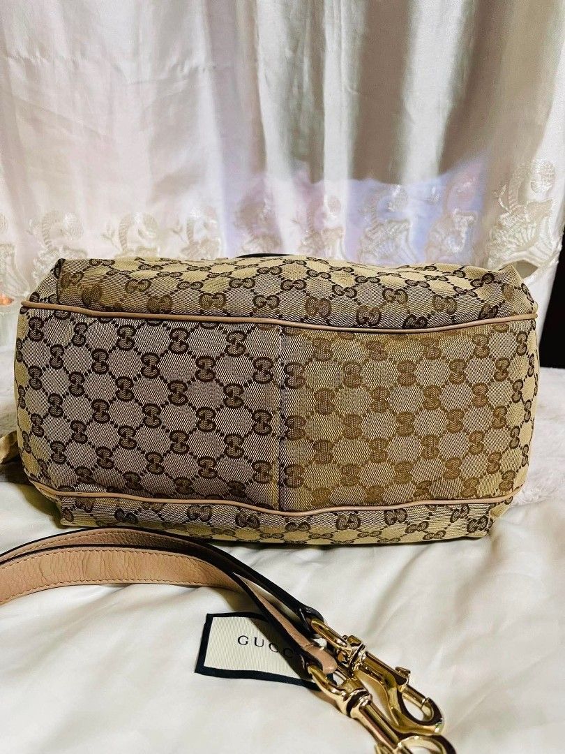 Gucci Monogram Canvas Hobo Bag with Leather Trim (Category: Luxury Bags & Wallets) located in Manila. Submitted by rangya (Listing ID 1457351186, Image 3). Description: - Authentic Gucci Hobo Bag - Classic GG Monogram Canvas - Tan Leather Accents - Signature Horsebit Detail on Front Flap - Adjustable Shoulder Strap - Gold-Tone Hardware - Ideal Everyday Bag #00.
