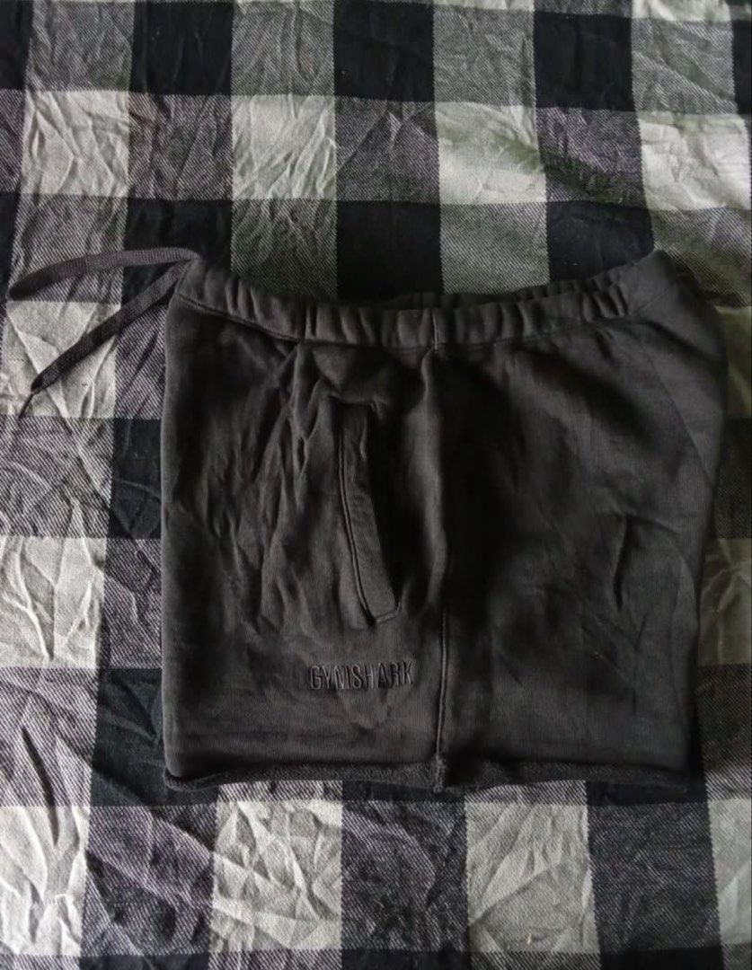 Gymshark Sweatshorts (Category: Activewear) located in Cebu City. Submitted by aisla_ (Listing ID 1457495725, Image 2). Description: Gymshark black sweat shorts Size- M on tag (can fit S-M) - Elastic waistband with drawstring - Side pockets - Small embroidered Gymshark logo on left leg - Comfortable and casual - Ideal for lounging or workouts.