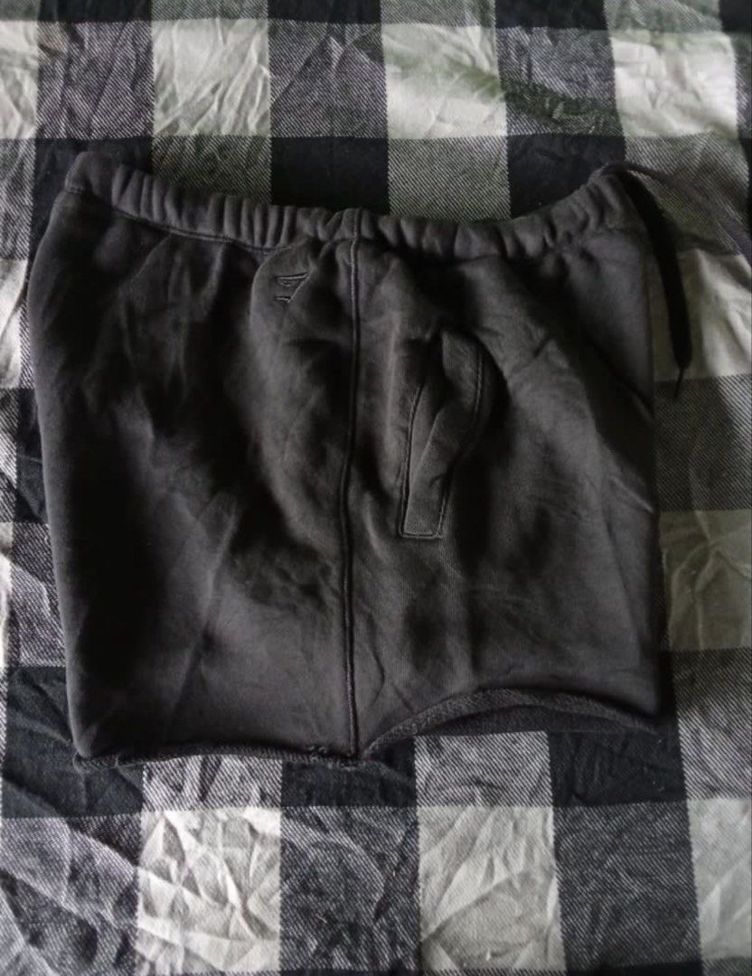 Gymshark Sweatshorts (Category: Activewear) located in Cebu City. Submitted by aisla_ (Listing ID 1457495725, Image 3). Description: Gymshark black sweat shorts Size- M on tag (can fit S-M) - Elastic waistband with drawstring - Side pockets - Small embroidered Gymshark logo on left leg - Comfortable and casual - Ideal for lounging or workouts.