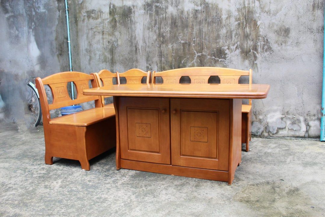 Japan Solid Wood Corner Dining Set with Storage 🇯🇵 (Category: Tables & Sets) located in San Fernando. Submitted by juls.japan.surplus (Listing ID 1457391679, Image 2). Description: Solid Wood Corner Dining Set with Storage Spacious table, built-in bench seating and a 2-door storage cabinet underneath. Finished in warm wood tones with elegant carved floral details, plus hidden storage under the bench seats and three-tier shelving inside the cabi