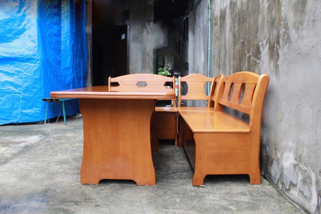 Japan Solid Wood Corner Dining Set with Storage 🇯🇵 (Category: Tables & Sets) located in San Fernando. Submitted by juls.japan.surplus (Listing ID 1457391679, Image 3). Description: Solid Wood Corner Dining Set with Storage Spacious table, built-in bench seating and a 2-door storage cabinet underneath. Finished in warm wood tones with elegant carved floral details, plus hidden storage under the bench seats and three-tier shelving inside the cabi