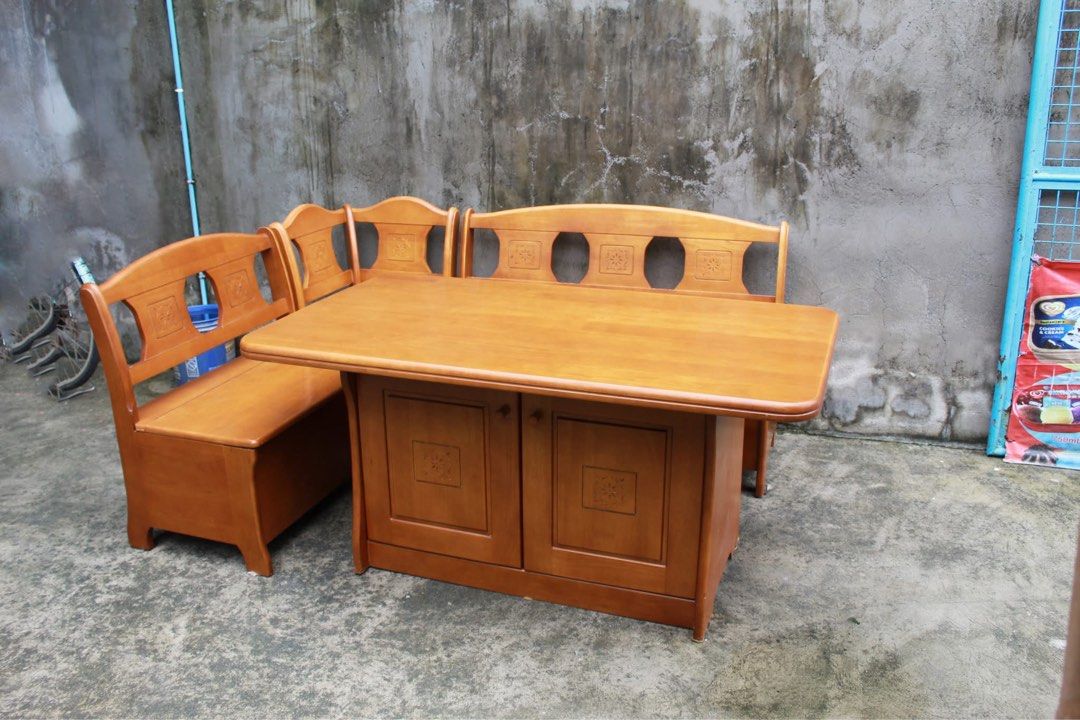 Japan Solid Wood Corner Dining Set with Storage 🇯🇵 (Category: Tables & Sets) located in San Fernando. Submitted by juls.japan.surplus (Listing ID 1457391679, Image 1). Description: Solid Wood Corner Dining Set with Storage Spacious table, built-in bench seating and a 2-door storage cabinet underneath. Finished in warm wood tones with elegant carved floral details, plus hidden storage under the bench seats and three-tier shelving inside the cabi