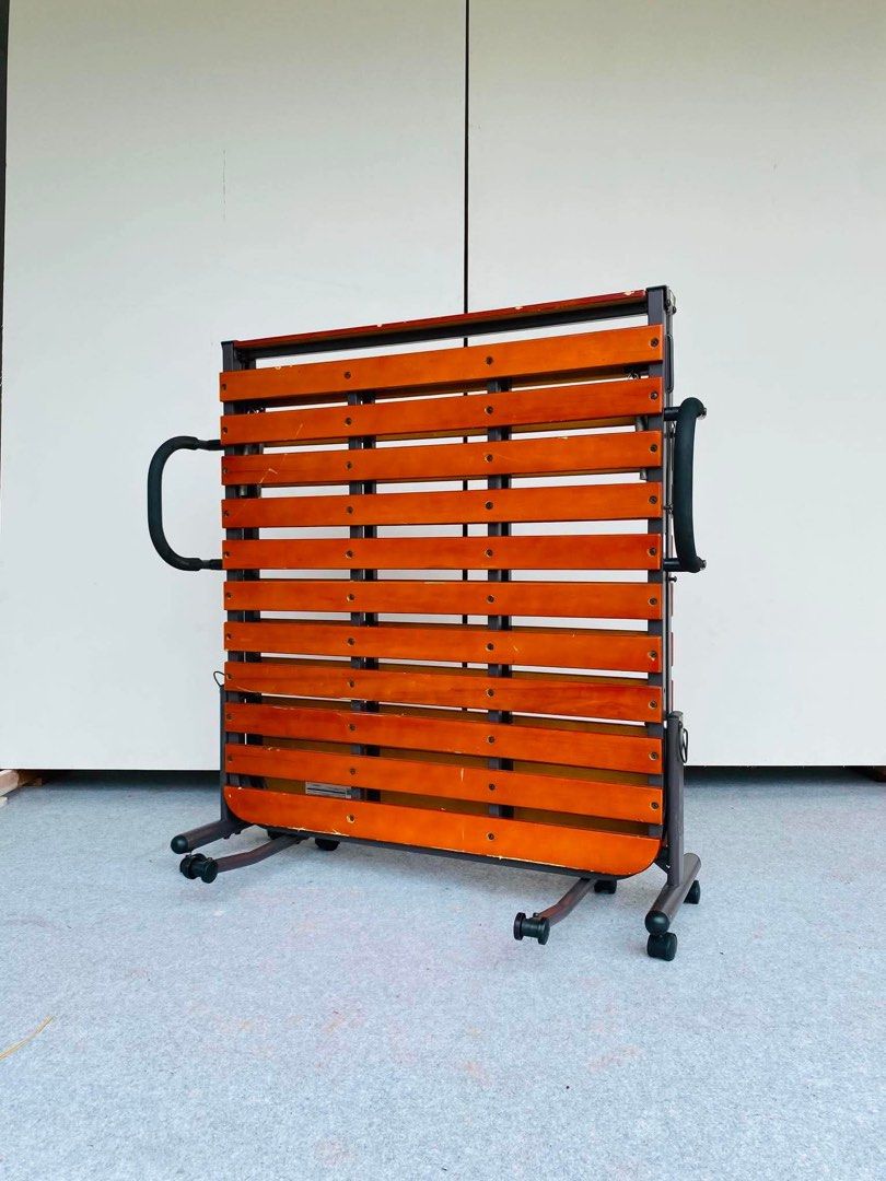 “JAPAN SURPLUS” WOODEN FOLDING BEDFRAME (Category: Bed Frames & Mattresses) located in Bulacan. Submitted by monmon555 (Listing ID 1457382211, Image 2). Description: “JAPAN SURPLUS” WOODEN FOLDING BEDFRAME SIZE: 77.5-81L” x 35W” x 15H” inches (AS-IS ITEM) IN GOOD CONDITION.