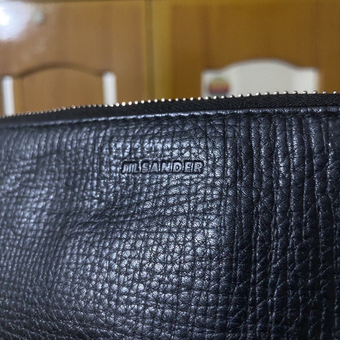 JIL SANDER Black Grained Leather Clutch Bag (Category: Belt bags, Clutches and Pouches) located in Manila. Submitted by 4114thrifts.ph (Listing ID 1457431370, Image 2). Description: Item Name: JIL SANDER Black Grained Leather Clutch Bag (Details) • Condition: Very Good Condition • Color Rate: 9.5/10 • Issue/s: Super Minimal Sign of Usage Mine: 1,550 Free Shipping 📥 Dasmariñas City, Cavite, 4114📍.