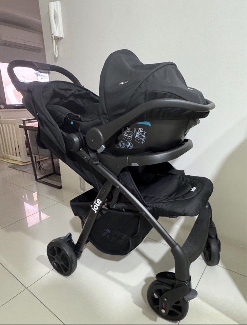 Joie Stroller with Infant Car Seat (Category: Strollers) located in Pasig City. Submitted by _secondchances (Listing ID 1457493568, Image 1). Description: - Joie stroller with compatible infant car seat (clicks in) - Convenient tray with cup holders - Ample storage basket underneath - Folds compactly for easy transport and travel.