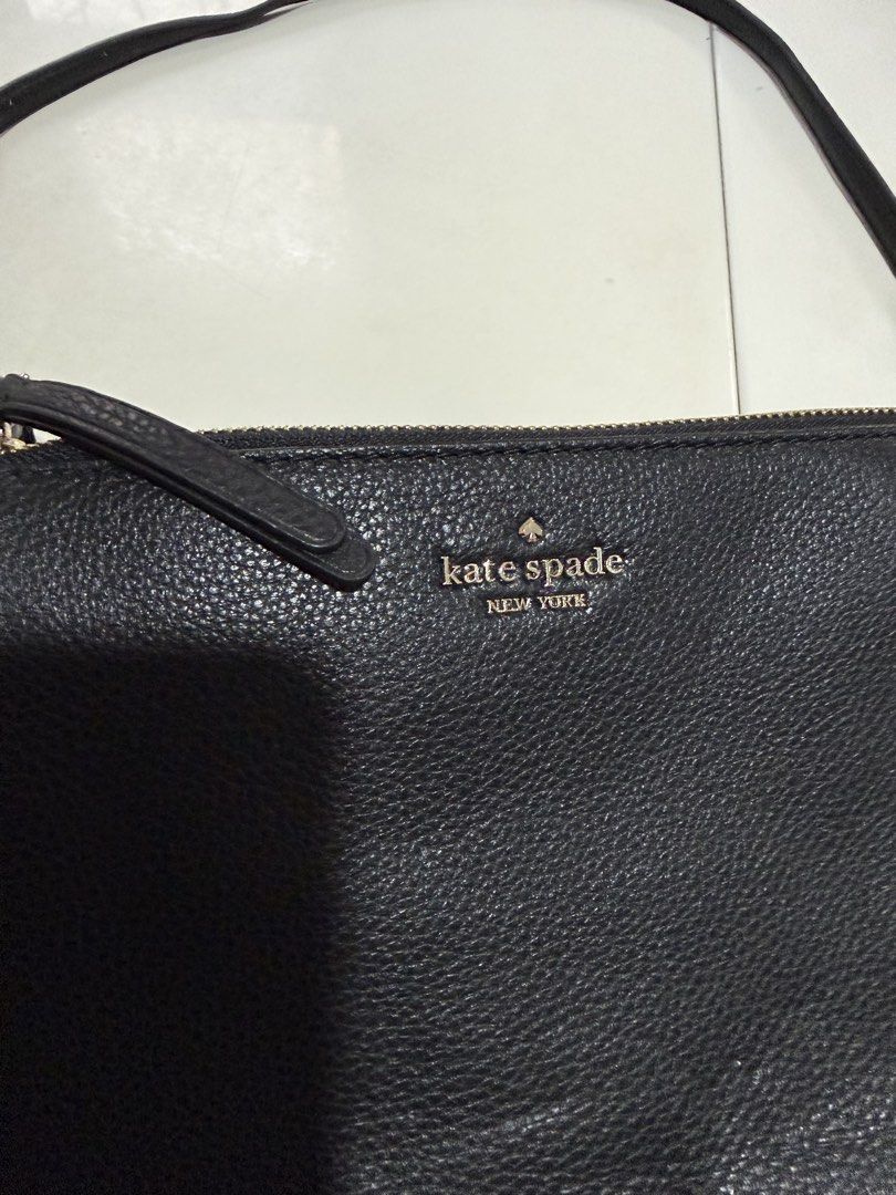 Kate Spade Black Leather Crossbody Bag (Category: Cross-body Bags) located in Cainta. Submitted by declutterwithaly (Listing ID 1457464073, Image 3). Description: - Brand: Kate Spade New York - Material: Black pebbled leather - Hardware: Gold tone - Closure: Zip - Interior: Multiple card slots - Strap: Adjustable - Condition: New with original tag - Ideal for: Everyday use or travel.