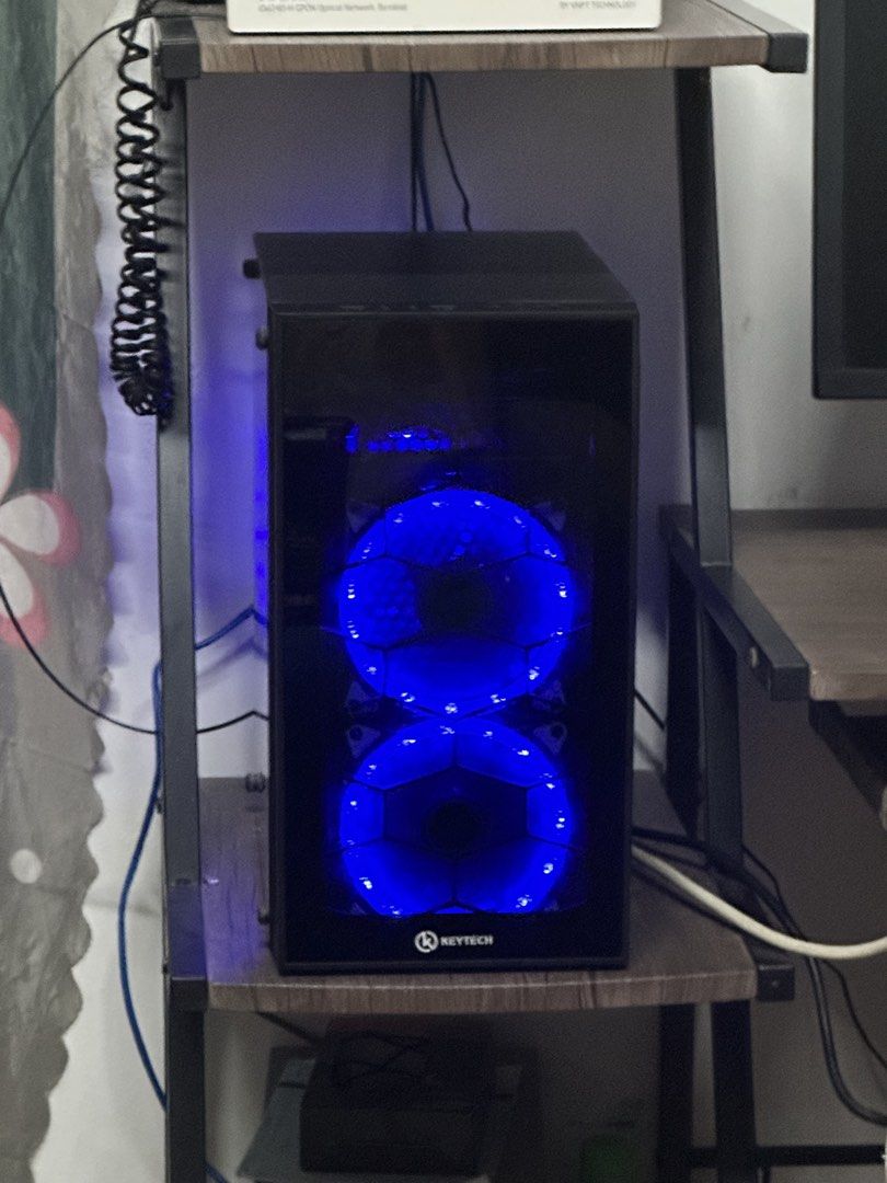 Keytech Desktop Computer Case with Blue LED Fans (Category: Desktops) located in Bulacan. Submitted by eardiente9 (Listing ID 1457452653, Image 3). Description: FOR SALE: SYSTEM UNIT 🖥️ Working and in good condition. System unit lang po wlang monitor Brand: Keytech Type: Desktop System Unit SPECS: • AMD PRO A12-8870E R7 Processor • 2.90GHz • 4 Cores • 8GB RAM • SOYO Motherboard • AMD Radeon R7 Graphics • Windows 10 Pro 64-bit • Glass Side Panel 