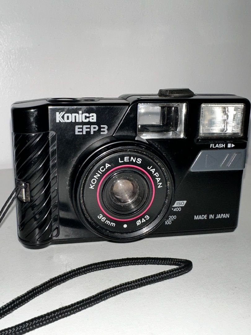 Konica EFP 3 35mm Film Camera (Category: Cameras) located in Pasig City. Submitted by kiimmmmm_ (Listing ID 1457409057, Image 2). Description: KONIKA EFP 3 36MM FOR ONLY PHP 1,500 RFS: NO LONGER IN USE • Working • Free strap • Issue - FLASH • Battery - Double AA (Easy to find) • Battery Needed (NOT INCLUDED) Selling a Konica EFP 3 camera. It has a Konica Lens Japan 36mm lens. The body is black and made in Japan. The flash is built-in. The film co