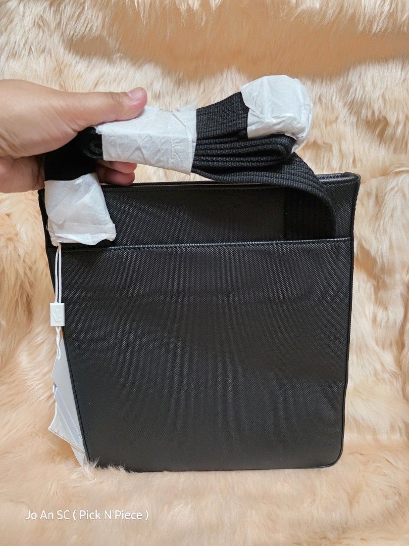 LACOSTE FLAT CROSSOVER BLACK BAG (Category: Sling Bags) located in Quezon City. Submitted by joansc (Listing ID 1457503413, Image 2). Description: SOURCED: SOUTH KOREA 100% ORIGINAL ONLY W/TAG, POLYPLASTIC.