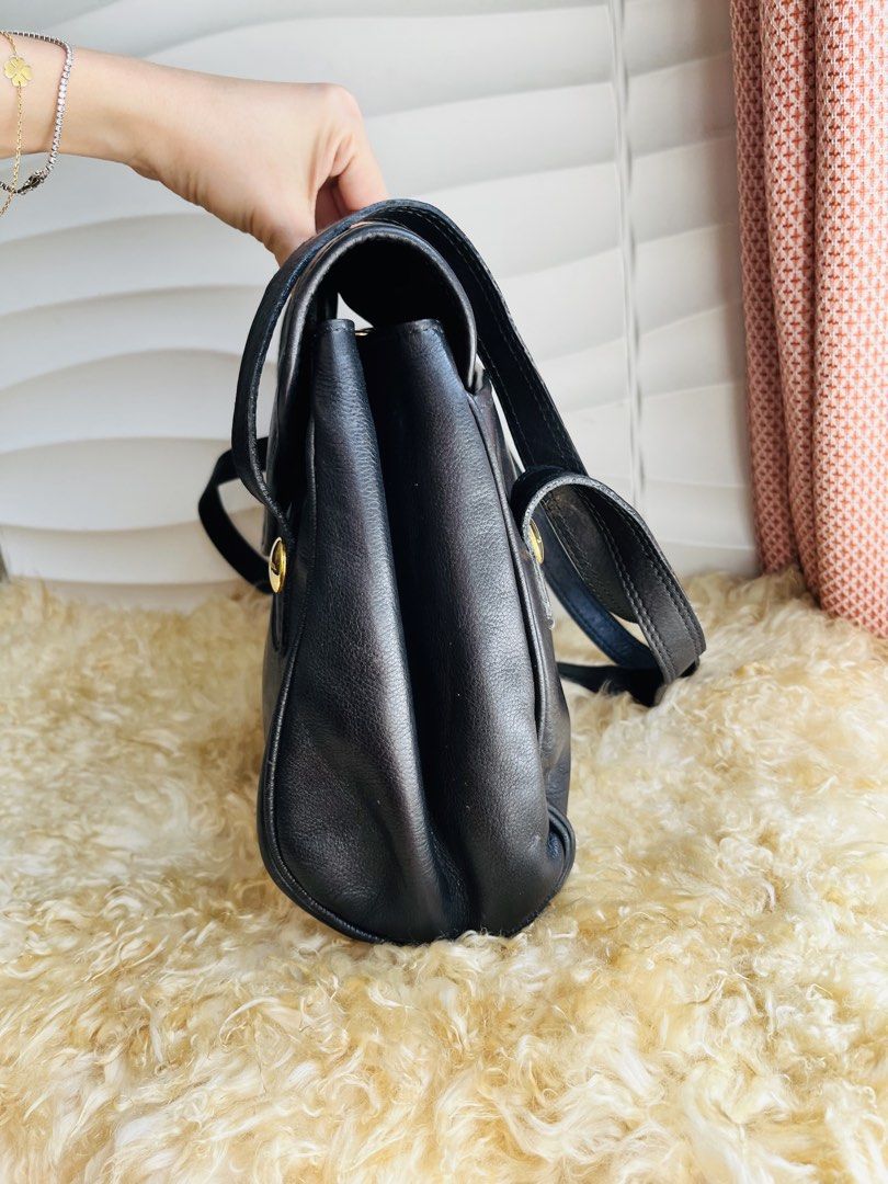 Lancel Long Handle Shoulder Bag (Category: Luxury Bags & Wallets) located in Davao. Submitted by goodthingsph_ (Listing ID 1457343301, Image 2). Description: - Classic black leather shoulder bag by Lancel - Features signature Lancel logo embossed on front flap - Elegant gold-tone hardware details - Adjustable shoulder strap for customized comfort - Timeless and versatile piece for daily use or special occasions.